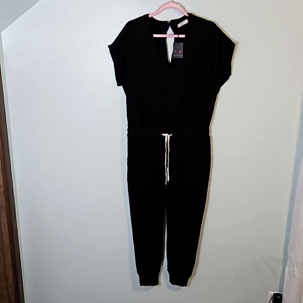 n:p philanthropy,  black romper. 100% cotton. Size L. NWT.